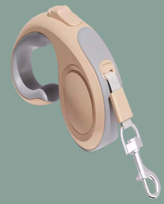 Retractable dog leash with tan and gray design on a light green background