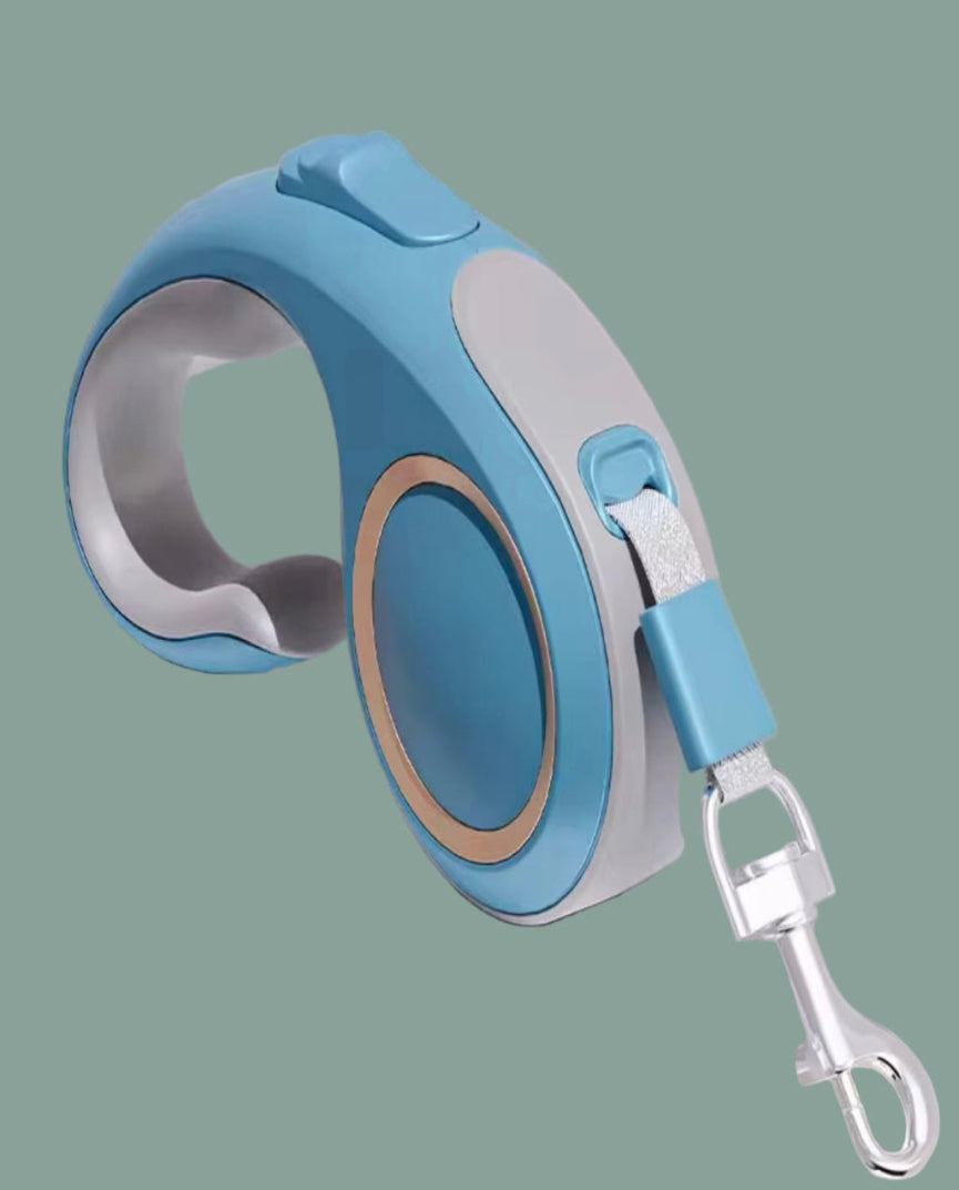 Blue and silver retractable dog leash on a gray background